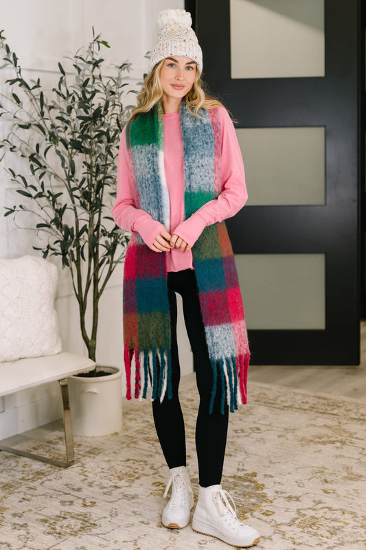 Wanderlust Wrap oversized checkered scarf in magenta with fringe, made from brushed fabric, perfect for layering as a cozy scarf or shawl from Bethany’s Chic Boutique