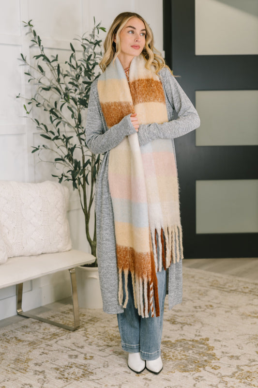 Wanderlust Wrap oversized plaid fringe scarf made from brushed fabric, perfect for layering as a cozy scarf or shawl from Bethany’s Chic Boutique